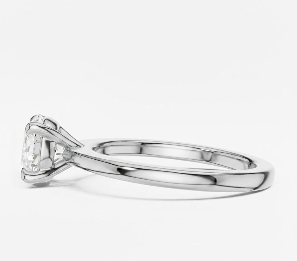 Riora minimalist gold moissanite solitaire promise ring with a thin stackable band and elegant dainty design.