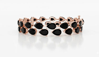 Pear cut moissanite diamond tennis bracelet in rose gold, featuring sparkling stones and delicate bridal wedding jewelry design