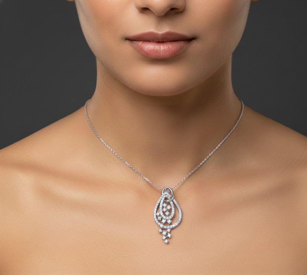 Elegant moissanite teardrop pendant necklace in gold, rose gold, or silver, featuring a sparkling bridal or Valentine's jewelry design.