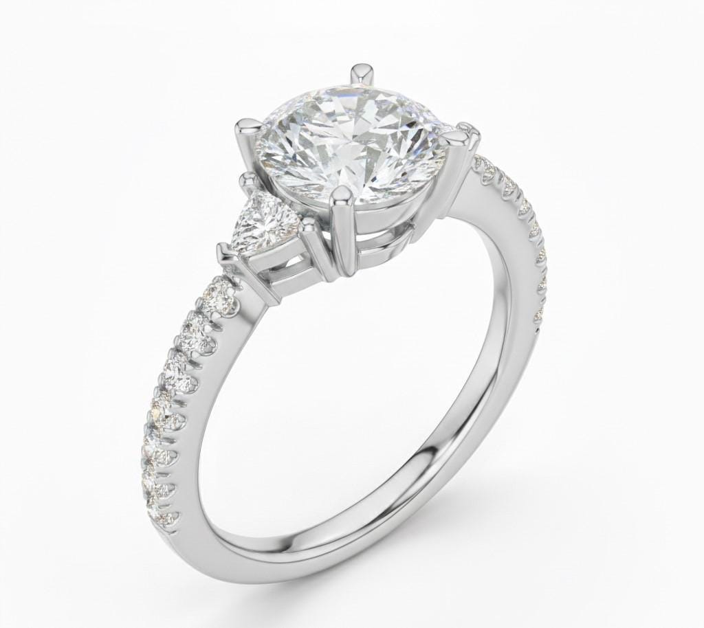 Elegant CZ engagement ring with gold, rose, and silver tones from Riora, featuring a sparkling central stone and delicate band.