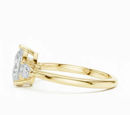 Pear cut cubic zirconia engagement ring by Riora in gold or silver, featuring a sparkling pear-shaped stone and a sleek band.
