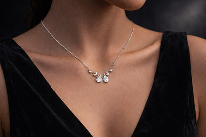 Riora moissanite cherry branch necklace with leaf pendant in rose gold and silver, minimalist nature-inspired bridal jewelry.