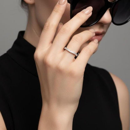 Riora moissanite curved wedding band in gold, hypoallergenic nickel-free ring with minimal diamond accents for stacking jewelry.