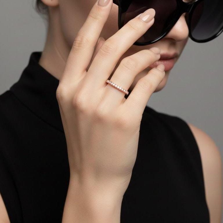Riora Moissanite curved wedding band in gold, nickel-free hypoallergenic ring with minimal diamond accents and stacking jewelry style.