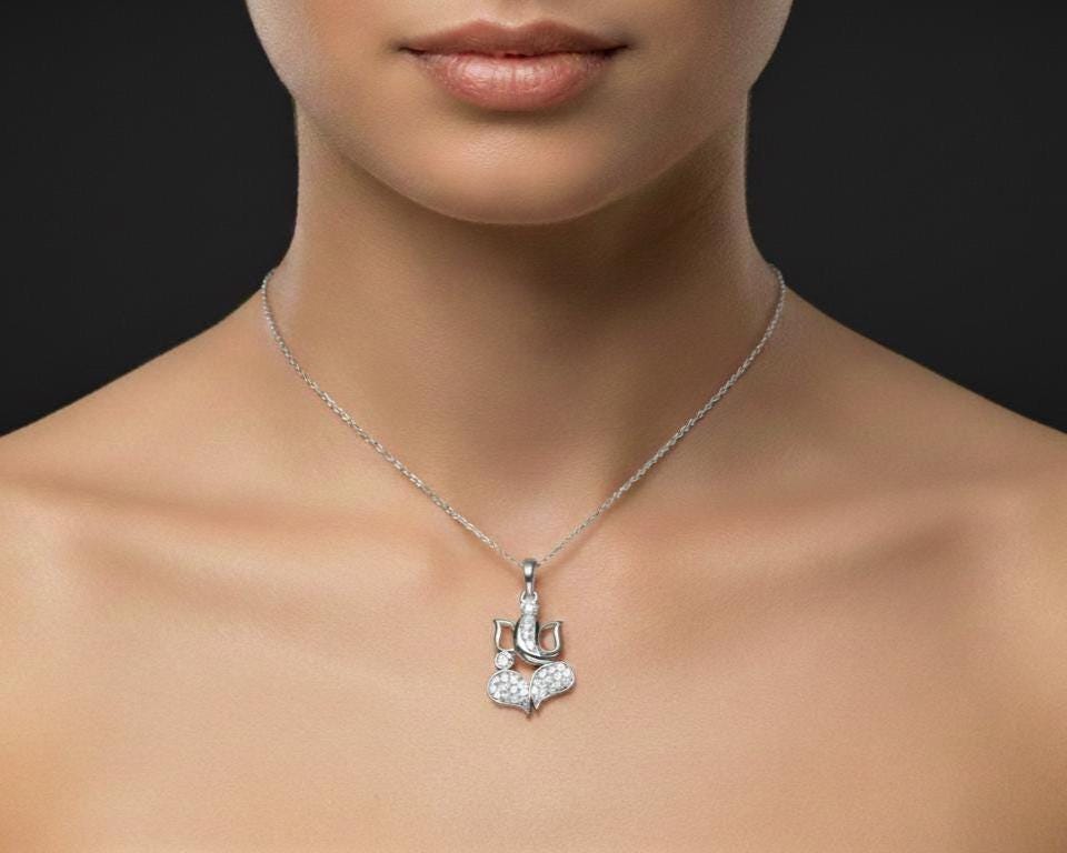 Riora Moissanite Lotus Heart Pendant Necklace showcasing a sparkling heart-shaped moissanite stone on a delicate chain