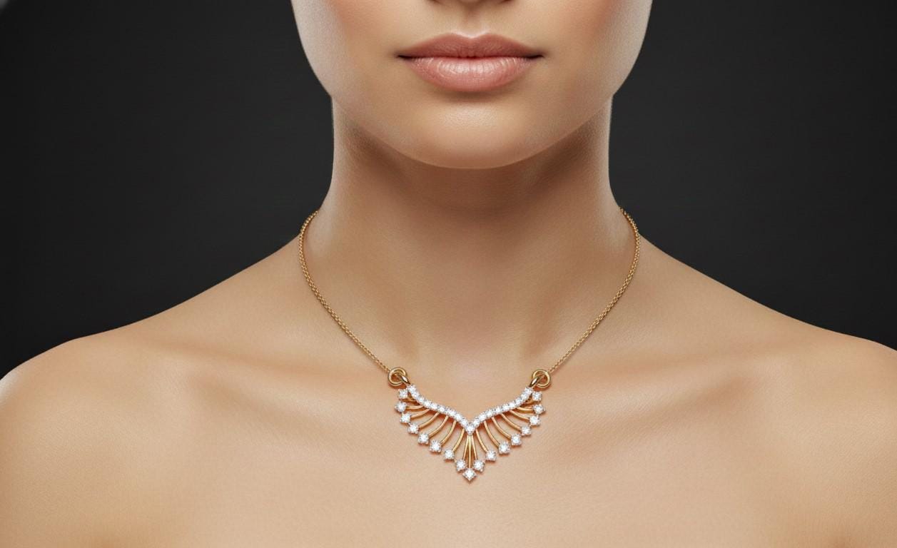 Gold necklace on a model against a black background
