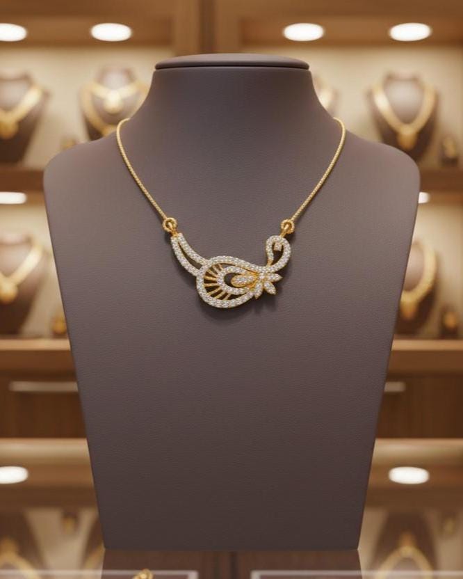 Gold moissanite leaf necklace by Riora featuring a delicate, minimalist design perfect for bridal jewelry or wedding gifts.