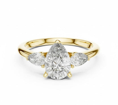 Pear cut cubic zirconia engagement ring by Riora with gold and silver bands, showcasing a sparkling center stone and elegant design.