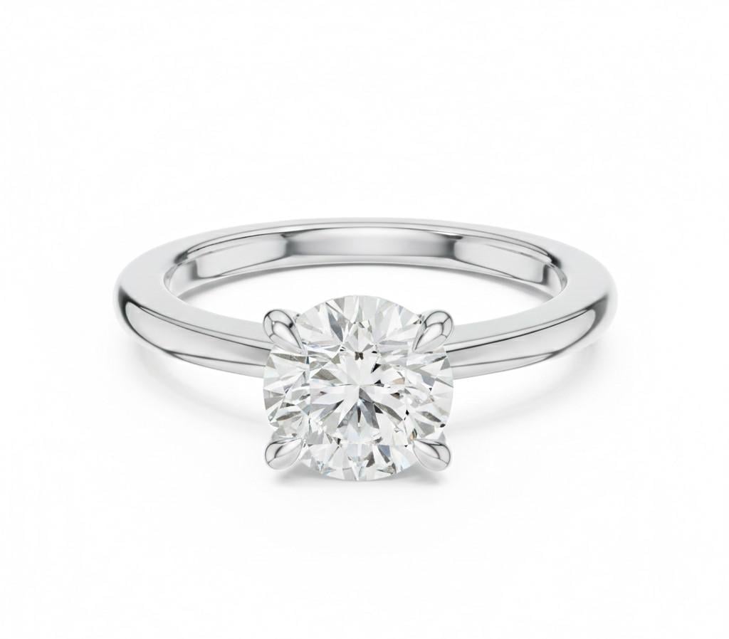 Riora minimalist gold moissanite solitaire ring with a dainty thin band, perfect for stacking or as a wedding promise ring.