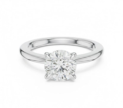 Riora minimalist gold moissanite solitaire ring with a dainty thin band, perfect for stacking or as a wedding promise ring.