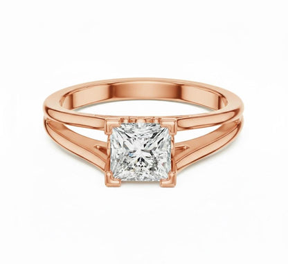 Rose gold princess cut CZ engagement ring by Riora featuring a minimalist design and silver accents on a white background.