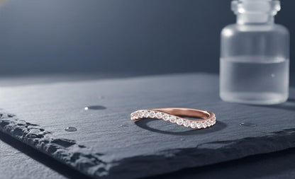 Riora moissanite curved wedding band in gold, nickel-free hypoallergenic ring with minimal diamond accents, stacking jewelry.
