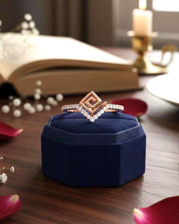 Rose gold geometric moissanite chevron ring with minimalist design, perfect for stacking or wedding bands, by Riora.
