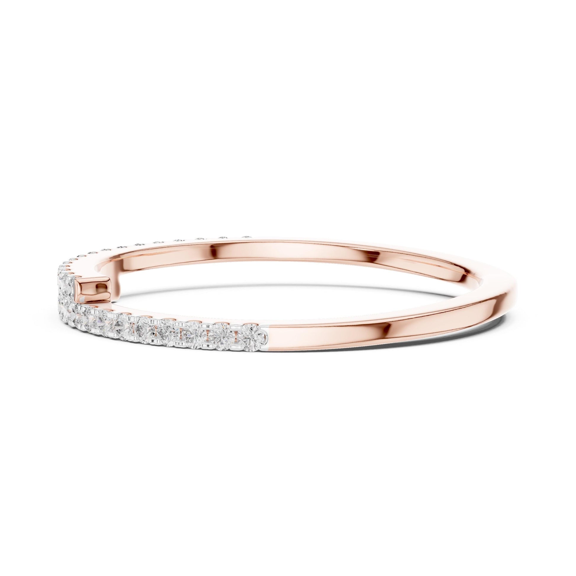 Rose gold moissanite curved wedding band with half eternity diamond style, minimalist stacking ring by Riora.