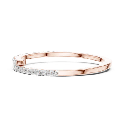Rose gold moissanite curved wedding band with half eternity diamond style, minimalist stacking ring by Riora.