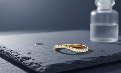 Riora moissanite curved wedding band in gold with a minimalist design, nickel-free hypoallergenic stacking jewelry.