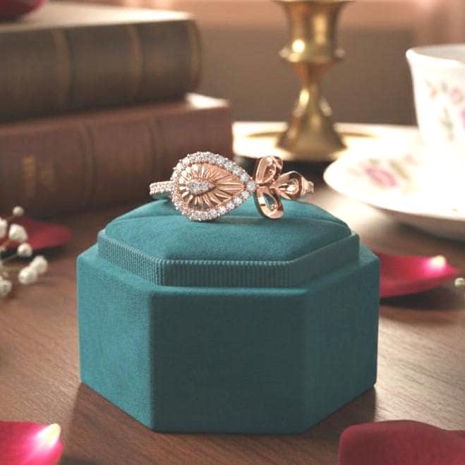 Vintage eye-shaped bow ring by Riora featuring moissanite diamonds, dainty evil band design, ideal for minimal women's jewelry.