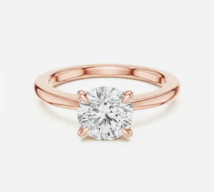 Riora minimalist moissanite diamond solitaire ring with a thin gold band, perfect for stacking or wedding jewelry.