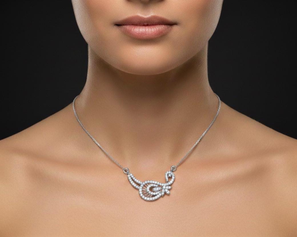 Gold moissanite leaf necklace by Riora featuring a delicate, minimalist design perfect for bridal or wedding jewelry.