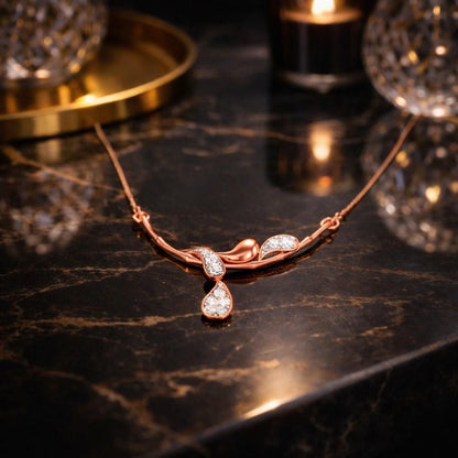 Riora moissanite drop pendant necklace in rose gold, elegant bridal jewelry with minimalist diamond style design, on a white background.