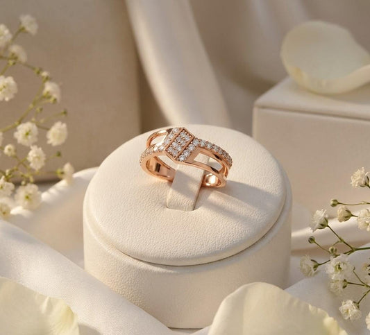 Riora modern CZ split shank geometric ring with gold and silver finish, featuring statement design and promise band style.