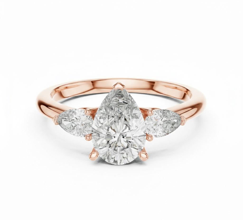 Pear cut cubic zirconia engagement ring by Riora in gold and silver, featuring a sparkling gemstone and elegant band design.