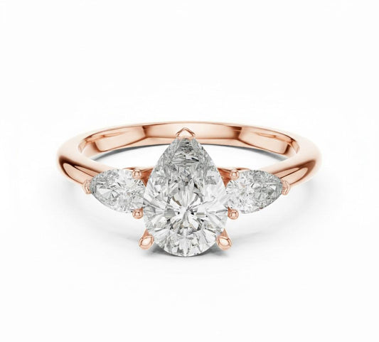 Pear cut cubic zirconia engagement ring by Riora in gold and silver, featuring a sparkling gemstone and elegant band design.