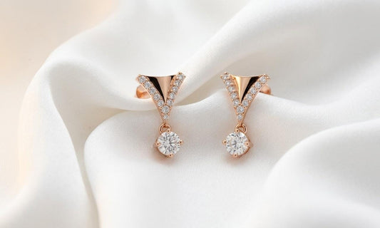 Riora moissanite drop earrings in V shape with rose gold and silver finishes, featuring dangle bridal jewelry design