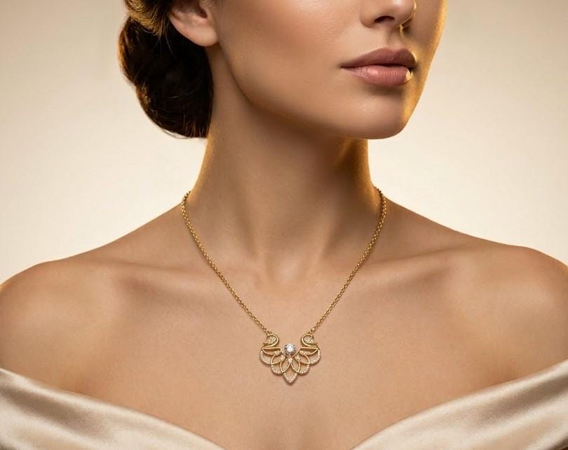 Elegant swan-shaped moissanite necklace by Riora featuring a rose gold pendant, perfect for bridal or romantic jewelry.