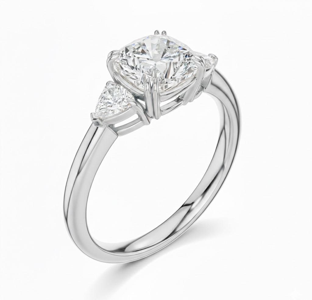 Elegant rose gold silver CZ engagement ring by Riora featuring a sparkling central gemstone and a delicate, hypoallergenic design.