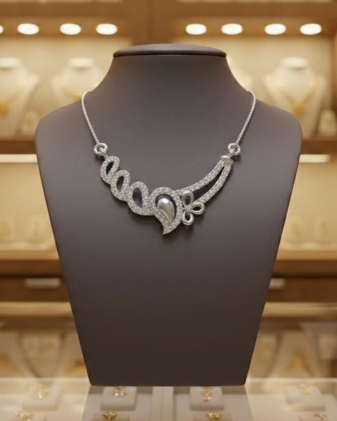 Rose gold floral swirl necklace with moissanite diamond accents, elegant wedding jewelry pendant for women, crafted by Riora.