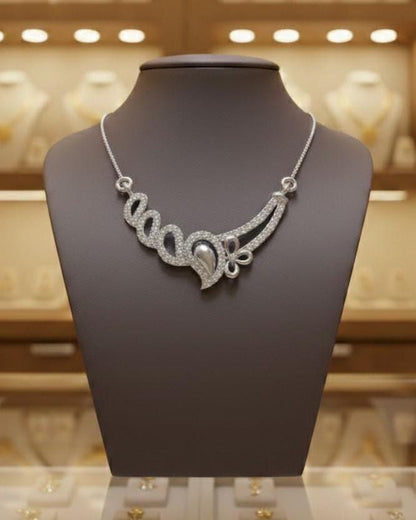 Rose gold floral swirl necklace with moissanite diamond accents, elegant wedding jewelry pendant for women, crafted by Riora.