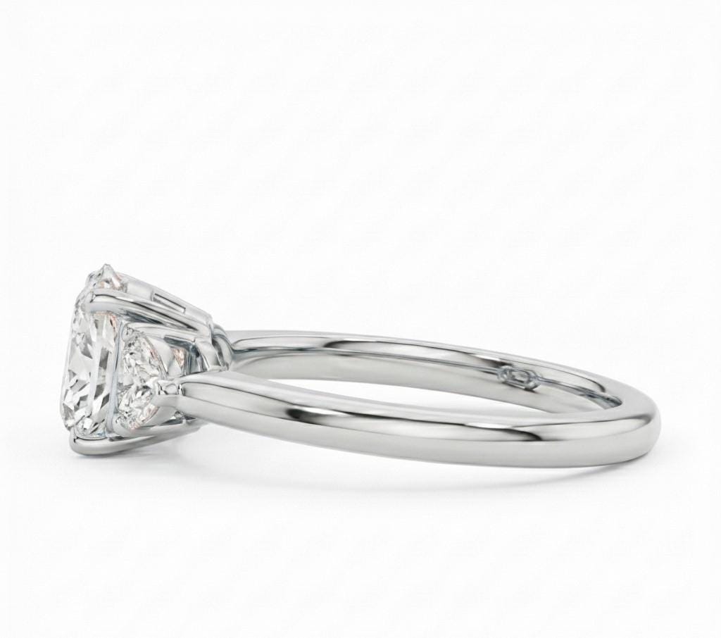 Rose gold and silver princess cut CZ engagement ring by Riora, featuring a minimalist design and sparkling central stone.