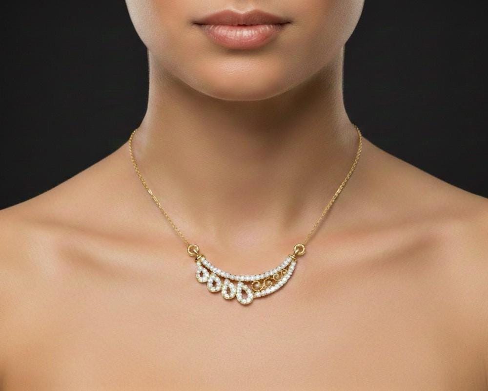 Rose gold teardrop moissanite necklace with elegant pendant, perfect for bridal jewelry or wedding gift, by Riora.