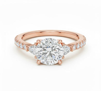 Elegant CZ engagement ring by Riora featuring gold, rose, and silver tones with a sparkling bridal design and hypoallergenic finish.