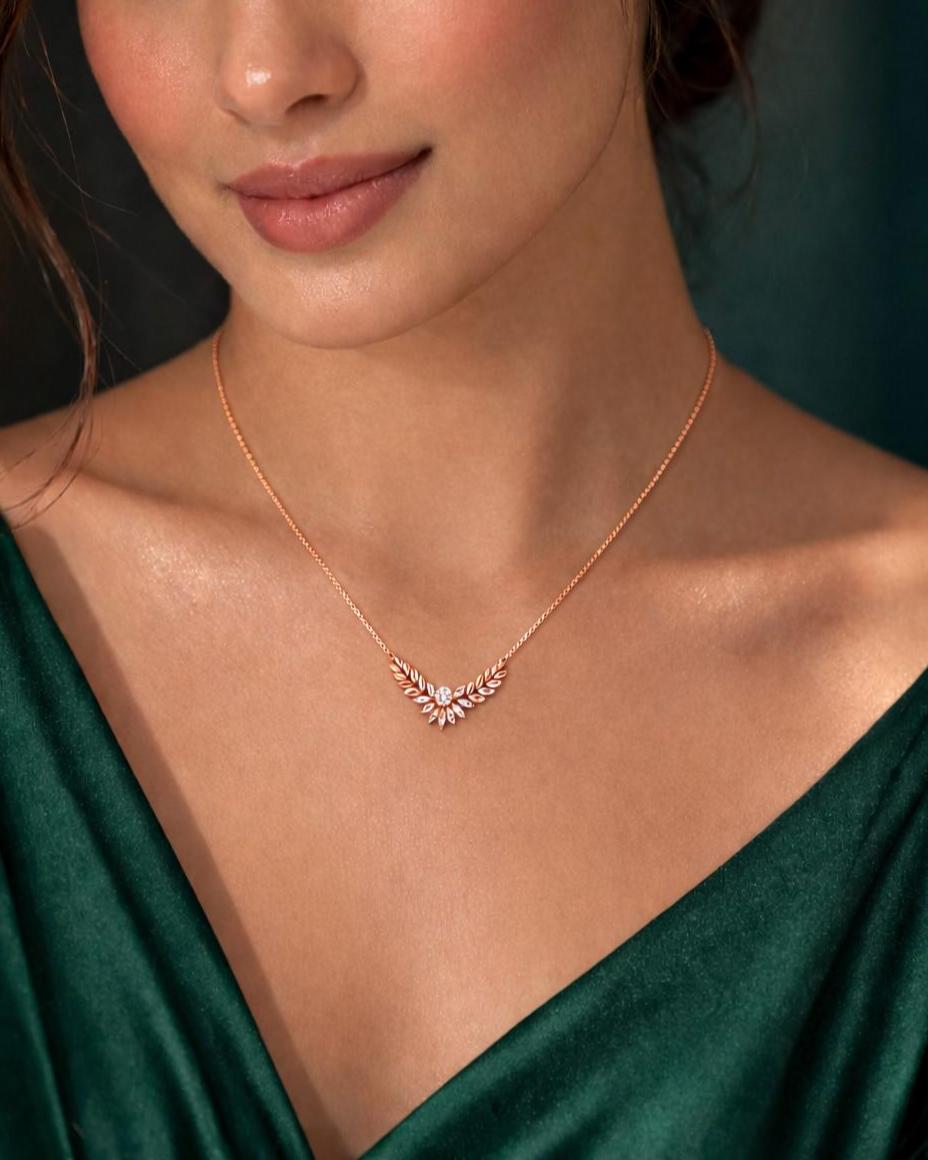 Riora Moissanite Laurel Leaf Necklace in gold and rose gold, minimalist bridal pendant with diamond-style sparkle.