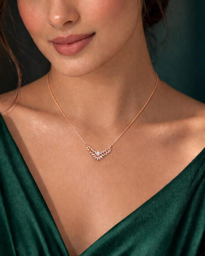 Riora Moissanite Laurel Leaf Necklace in gold and rose gold, minimalist bridal pendant with diamond-style sparkle.