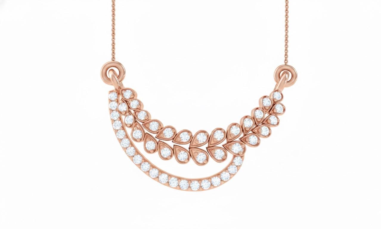 Riora elegant moissanite diamond leaf necklace in gold and silver, minimalist bridal jewelry for women on a white background.