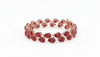 Pear cut moissanite diamond tennis bracelet in rose gold, featuring delicate bridal wedding jewelry with sparkling stones.