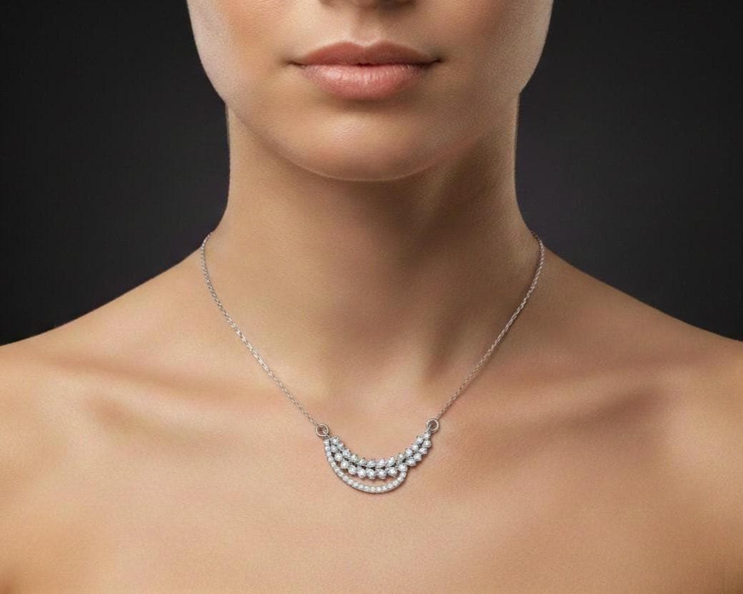 Elegant moissanite diamond leaf necklace by Riora, featuring a gold and silver minimalist design perfect for bridal and wedding gifts.