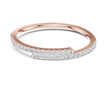 Rose gold moissanite curved wedding band with half eternity diamond style design, minimalist stacking ring by Riora.