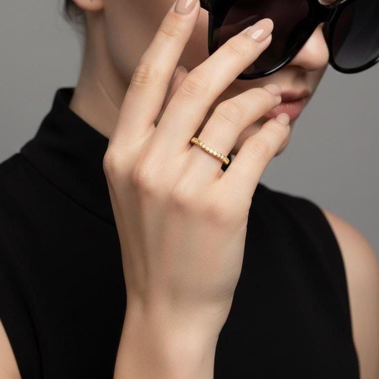 Riora moissanite curved wedding band in gold, hypoallergenic nickel-free ring with minimal diamond accents for stacking jewelry.