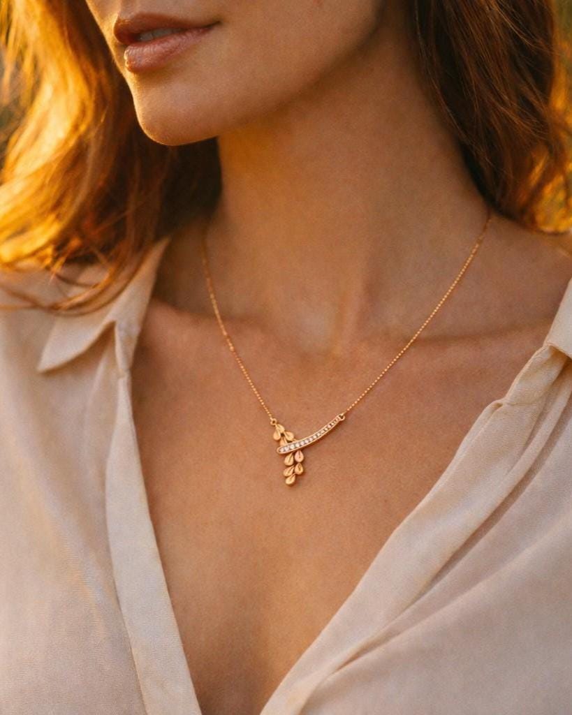 Rose gold moissanite leaf drop necklace with dainty botanical-inspired pendant, minimalist bridal jewelry by Riora.