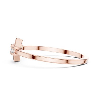 Rose gold three stone moissanite diamond ring with minimalist design, featuring three sparkling gemstones on a delicate band.
