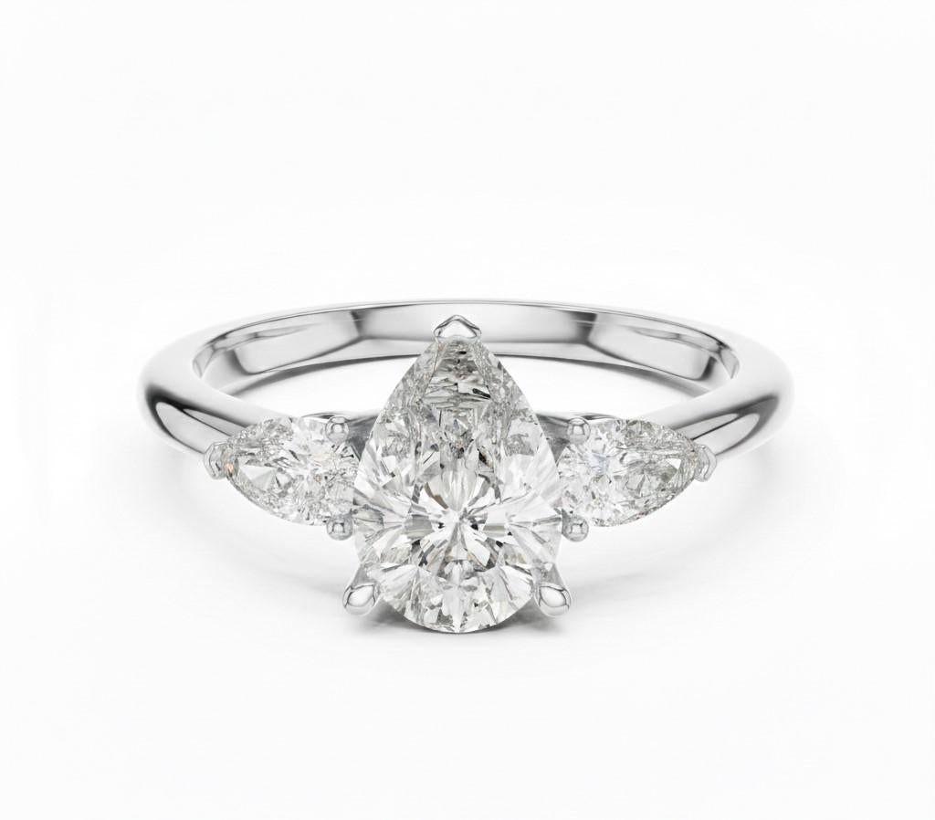Pear cut cubic zirconia engagement ring by Riora in gold or silver, showcasing a sparkling gemstone set in a sleek band.