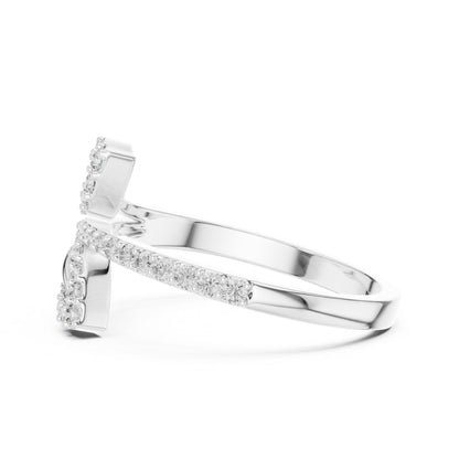 Rose gold leaf wrap moissanite diamond engagement ring with botanical design, dainty wedding band by Riora.