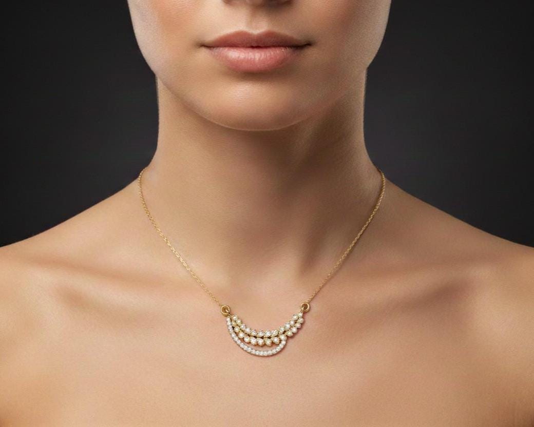 Elegant moissanite leaf necklace in gold and silver by Riora, featuring a minimalist design perfect for bridal and wedding gifts.