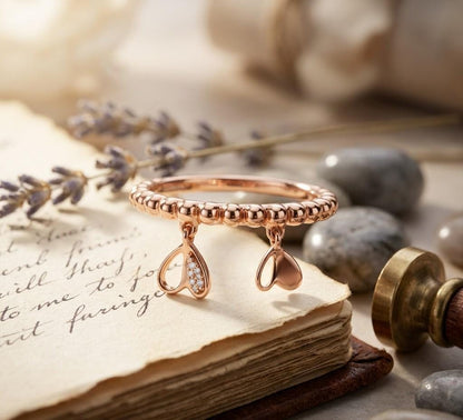 Rose gold Moissanite heart charm dangle ring with beaded band, minimal romantic jewelry by Riora.