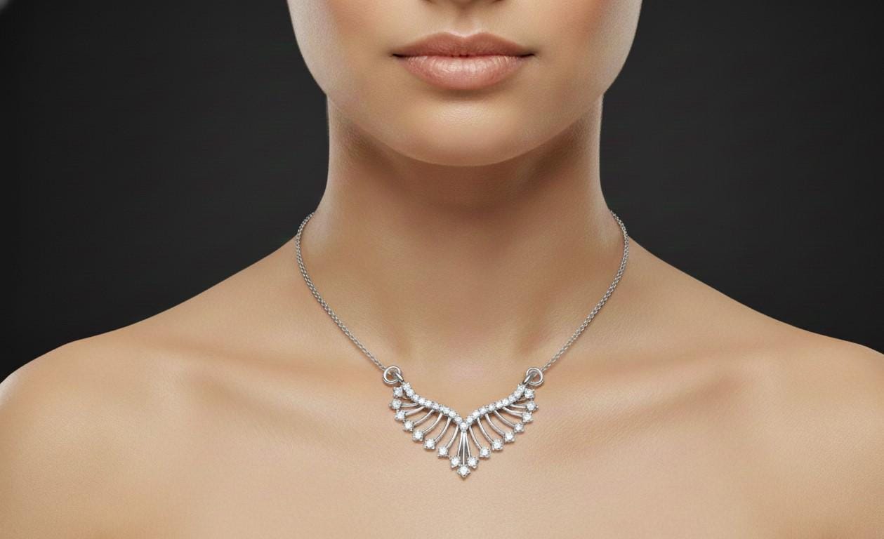 Silver necklace on a mannequin against a black background