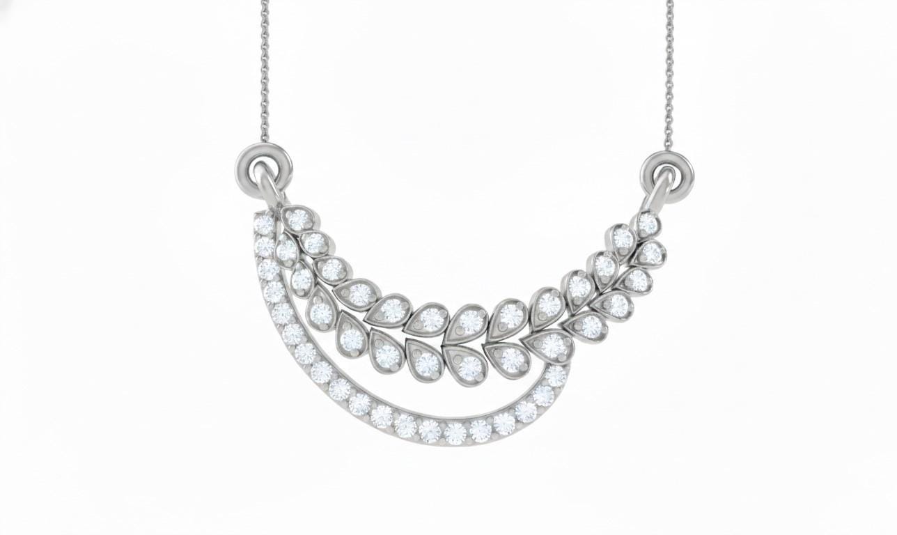 Elegant moissanite diamond leaf necklace by Riora, featuring gold and silver finishes, perfect for bridal or minimalist wedding jewelry.